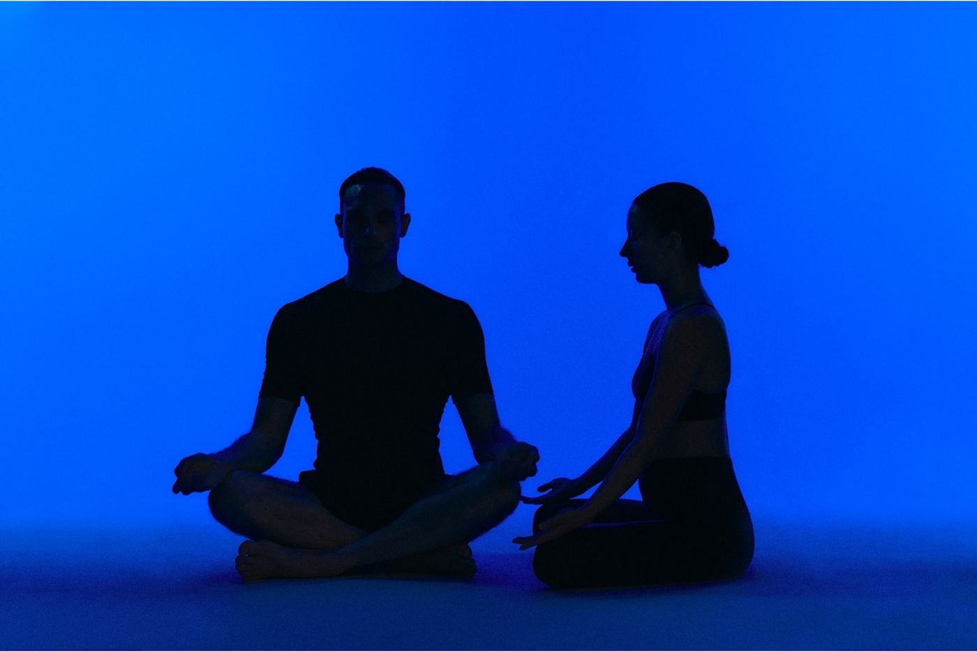 Rooftop Lab — two people meditating in blue light